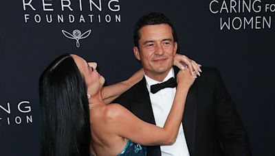 Orlando Bloom appears to sneak a peek at Kim Kardashian's derrière