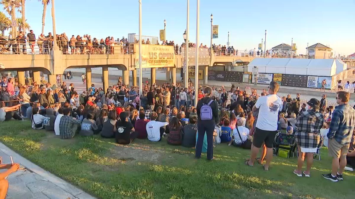 Vigil held for missing Huntington Beach swimmer as Coast Guard calls off search