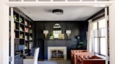 Painting dated paneling a dark color creates a cozy feel in a home library - The Boston Globe