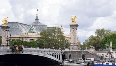 Poor water quality in Seine causes cancellation of swimming triathlon training but organisers remain hopeful for event