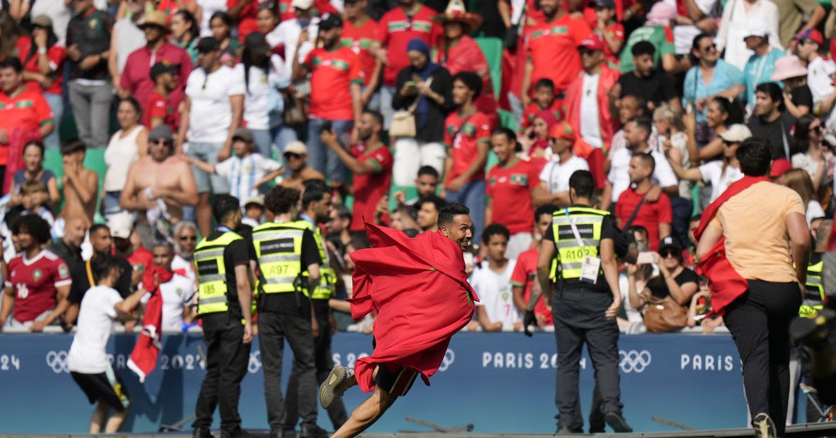 Olympic soccer gets off to violent and chaotic start as Morocco fans rush the field vs Argentina