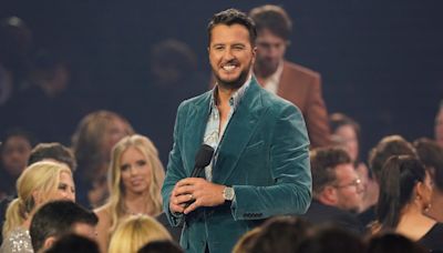 'My lawyer will be calling': Luke Bryan jokes after slipping on fans cell phone on stage