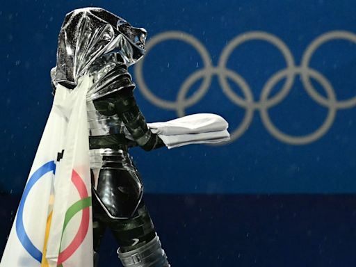 Who were the masked torchbearer and horse rider at the Olympics opening ceremony?
