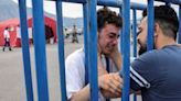 Emotional reunion amid despair as Greece searches for shipwreck survivors