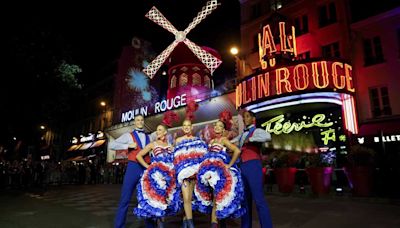 The Moulin Rouge cabaret in Paris has its windmill back, weeks after a stunning collapse