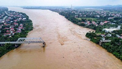 Cars plunge into river as super typhoon destroys Vietnam bridge