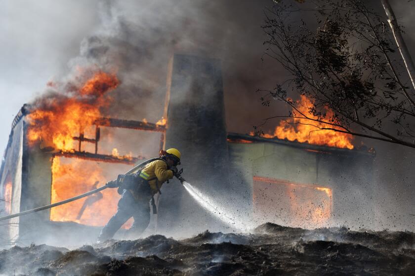 Neighbors fight flames as Edgehill fire consumes homes in San Bernardino; one person detained