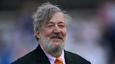 ‘This is my first outing’: Stephen Fry uses walking stick after breaking his leg, pelvis and ‘a bunch of ribs’