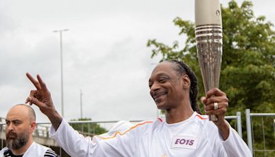 Snoop Dogg Carries Olympic Torch In Paris, Sets Internet Ablaze With Memes