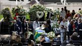 Pele to be buried today after lying in state as thousands of fans queue to pay tribute