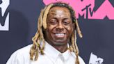 Lil Wayne hilariously reacts to his wax figure: 'Dat s--- ain't me!'