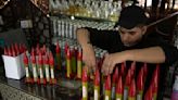 Rocket perfume, anyone? A Gaza vendor sells scents in bottles shaped like rockets fired at Israel