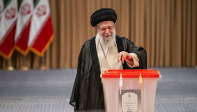 Iranians vote in run-off election between hardliner and reformist