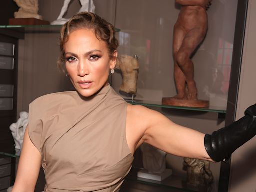 Jennifer Lopez debuts trench coat style at Paris show as Ben Affleck stays in US