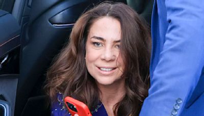 Kate Ritchie looks worse for wear as she stumbles out of car