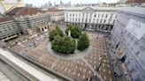 Mock coffins fill a square in Milan in a protest over workplace safety in Italy