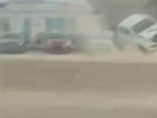 Moment Florida tornado lifts parked truck into traffic