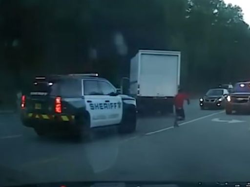 Video shows man crashing into deputies, troopers after stealing box truck
