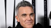 Robbie Williams randomly defaces road sign to spell 'resident penis holders only'