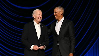 Joe Biden appears to freeze again at fundraiser as Barack Obama helps him off stage