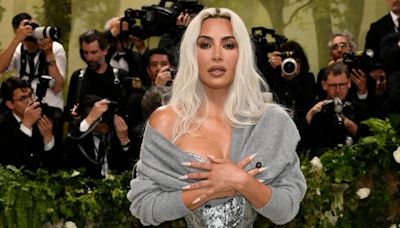 Fans are divided over Kim Kardashian’s Met Gala sweater. She explains why she wore it