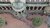 Voters queue in long lines outside Johannesburg City Hall with turnout set to be well above the last election in 2019