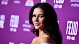 Catherine Zeta-Jones has an 'oops' moment in racy, cut–out swimsuit