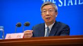 Favoring continuity, China reappoints central bank governor