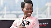 Why Did Lupita Nyong’o Accessorize Her Bubblegum Suit With a Live Cat?