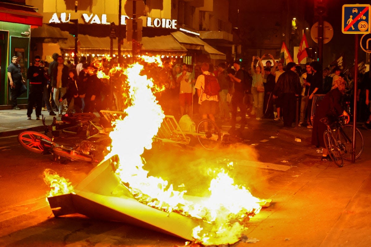 Violent protest against far-right National Rally erupt in Paris as Macron urges tactical voting