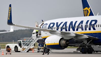 184 passengers and crew evacuated as Ryanair Boeing plane catches fire on runway in Italy