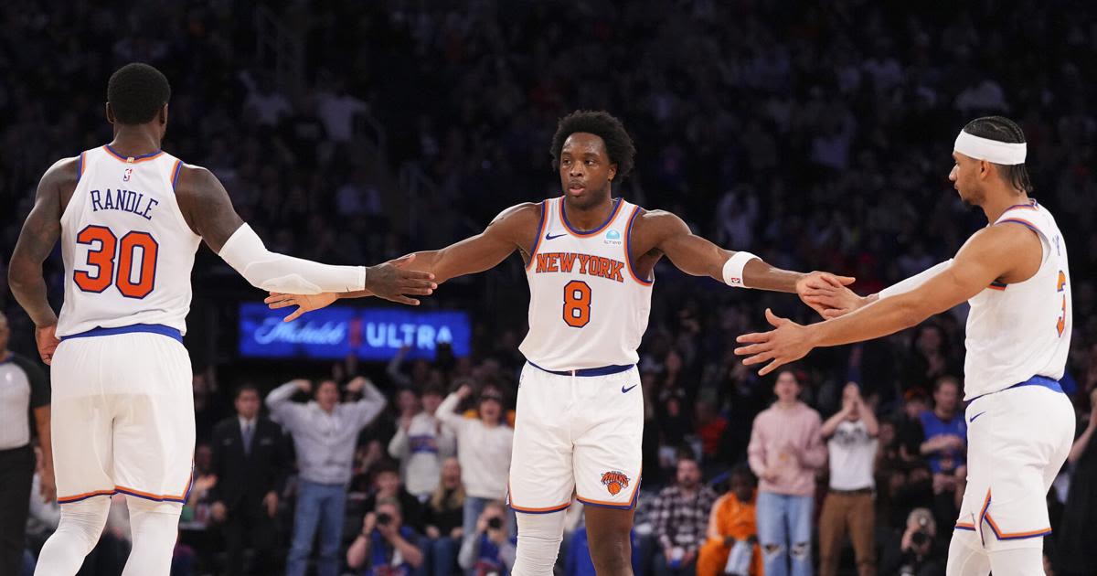 OG Anunoby of the New York Knicks celebrates with Julius Randle and Josh Hart against the Minnesota Timberwolves in the second half at Madison Square...