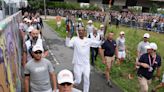 Snoop Dogg carries Olympic torch in Paris