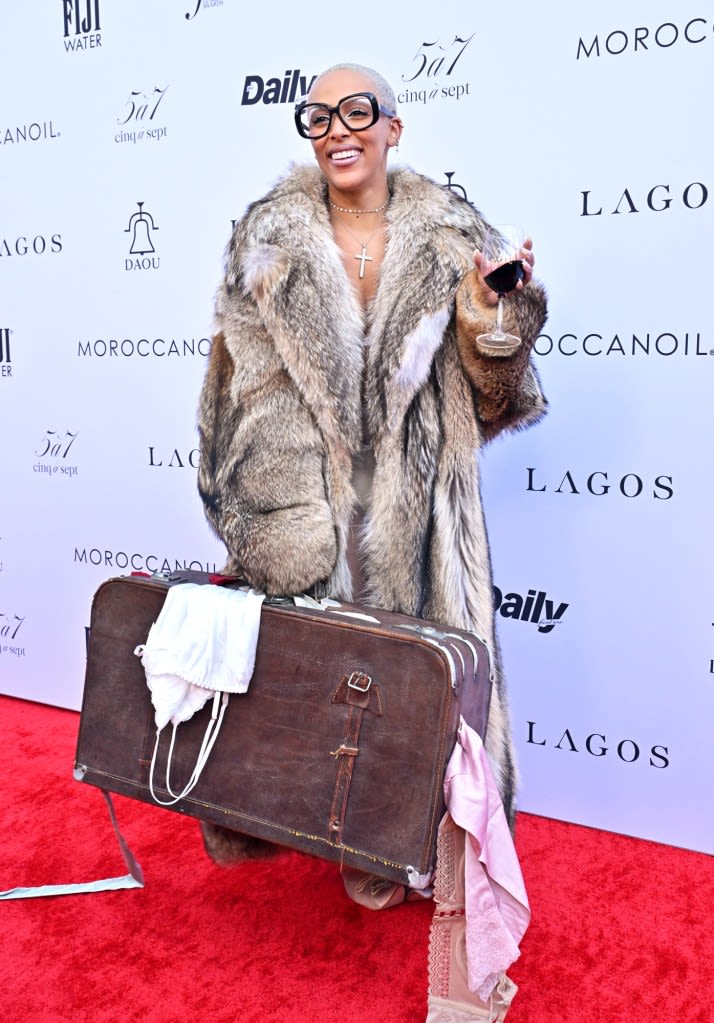 Doja Cat Carries a Suitcase on Daily Front Row Fashion Awards Red Carpet