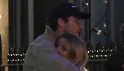 Ellie Goulding is pictured in a tight embrace with Caspar Jopling