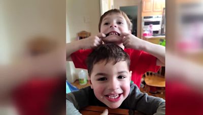 Firefighters say 6-year-old was protecting his 3-year-old brother when they died in house fire