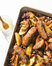 Roast Italian sausages over potatoes and peppers for a flavorful one-pan supper
