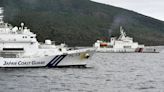 Chinese armed vessels patrol waters around disputed islands, angering Japan