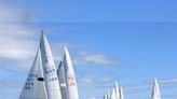 Olympic sailing ready to start with fast windsurfing, light winds, hot sun