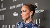 JLo's slicked-back bun and epic statement earrings is the easy glam combo we're definitely going to copy