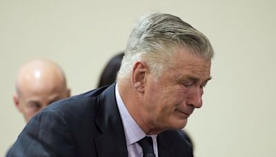 Alec Baldwin weeps in court when judge announces involuntary manslaughter case dismissed mid-trial