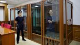 Evan Gershkovich appears in glass cage as espionage trial begins in Russia