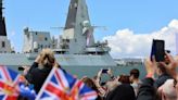 Warship returns after landmark trip - but helicopter issue means defence secretary misses the action