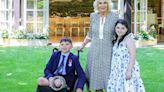 Queen Camilla gives two young fundraising heroes' own Buckingham Palace party