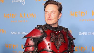 Elon Musk Mocked for Claiming Christianity Is Under Attack While Wearing Baphomet Armor With Upside Down Crosses in...