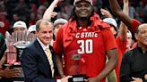 DJ Burns Jr. of North Carolina State celebrates with ACC Commissioner Jim Phillips after winning the MVP of the Championship Game of the ACC ...