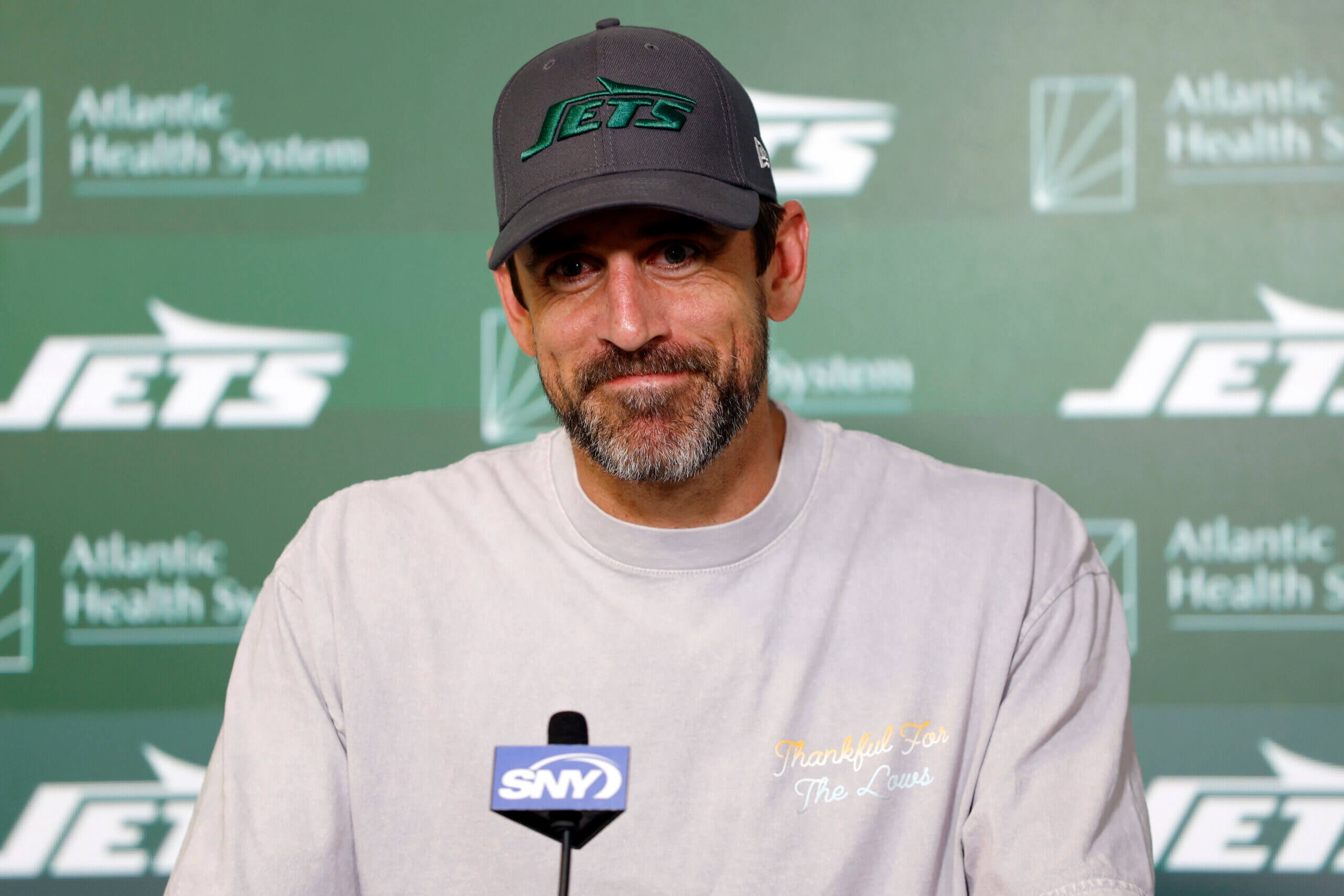 New York Jets training camp battles, featuring Aaron Rodgers vs. distractions