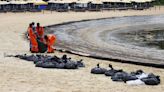 Singapore intensifies oil spill clean up after it spreads along coast