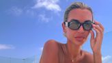 Christine McGuinness sunbathes topless during lavish holiday