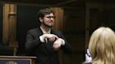 A Gallaudet University student signs in American Sign Language during a debate between Gallaudet’s debate team and the Philodemic Society, Georgetown University...